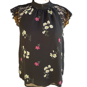 Black lace shoulders and a pink and white flower design M vince camuto